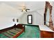 Charming bedroom with antique dresser, complemented by patterned wallpaper and a ceiling fan at 302 S Sherman Dr, Indianapolis, IN 46201