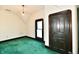 Bedroom featuring vintage molding, green carpet, and a bright window at 302 S Sherman Dr, Indianapolis, IN 46201