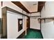 Functional closet with shelving and hanging storage, complemented by a vintage clock at 302 S Sherman Dr, Indianapolis, IN 46201