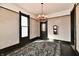 Dining room with a vintage chandelier and an ornate area rug at 302 S Sherman Dr, Indianapolis, IN 46201