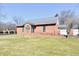 Attractive brick building featuring symmetrical design and large green lawn at 302 S Sherman Dr, Indianapolis, IN 46201