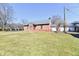 Stunning brick building with symmetrical architecture, green lawn, and a sunny sky at 302 S Sherman Dr, Indianapolis, IN 46201