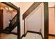Traditional hallway features dark wood trim, marble floors, stairs, and a decorative chandelier at 302 S Sherman Dr, Indianapolis, IN 46201