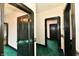 This hallway has green carpet and dark-wood trimmed doors and trim at 302 S Sherman Dr, Indianapolis, IN 46201