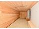 Unfinished basement area featuring wood walls and ceiling, an inset light, and bench at 302 S Sherman Dr, Indianapolis, IN 46201
