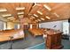 Spacious church interior featuring wooden pews, tongue and groove ceiling, and a traditional podium at 302 S Sherman Dr, Indianapolis, IN 46201