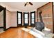 Living room with wood-burning stove, wood floors and natural light at 302 S Sherman Dr, Indianapolis, IN 46201