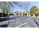 Asphalt parking lot with bare trees on a sunny day at 302 S Sherman Dr, Indianapolis, IN 46201