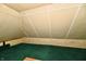 Finished attic featuring unique ceiling, carpeting, and compact design at 302 S Sherman Dr, Indianapolis, IN 46201