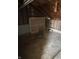 Attic space with exposed rafters, concrete floor, and room for storage or renovation at 3531 Welch Dr, Indianapolis, IN 46224