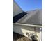 Exterior of the property highlighting the roof and gas meter, set against a clear blue sky at 3531 Welch Dr, Indianapolis, IN 46224