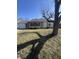 Well-maintained single-story home with an attached garage and a mature tree at 3531 Welch Dr, Indianapolis, IN 46224