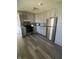 Renovated kitchen featuring gray cabinets, stainless steel appliances, and modern backsplash at 3531 Welch Dr, Indianapolis, IN 46224
