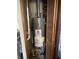 Enclosed utility closet equipped with a water heater system for home's hot water supply at 3531 Welch Dr, Indianapolis, IN 46224