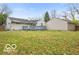 View of backyard, deck, home and a detached garage at 3550 N Edmondson Ave, Indianapolis, IN 46226