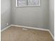 Cozy bedroom featuring neutral carpet, gray walls and natural light from a window at 3550 N Edmondson Ave, Indianapolis, IN 46226