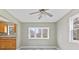 Dining room features gray tile floors, a ceiling fan, and a large window at 3550 N Edmondson Ave, Indianapolis, IN 46226