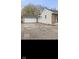 Exterior of a home with an asphalt driveway and detached garage at 3550 N Edmondson Ave, Indianapolis, IN 46226