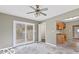 Open-concept living room with sliding doors and a view of the outside deck at 3550 N Edmondson Ave, Indianapolis, IN 46226