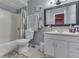 A simple bathroom with a vanity, mirror, and shower-tub combination at 3652 Yellow Poplar Ct, Indianapolis, IN 46222