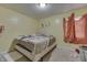 Standard bedroom with a bed, window, and carpeted floors at 3652 Yellow Poplar Ct, Indianapolis, IN 46222