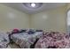 Modest bedroom featuring basic furnishings and a ceiling fan at 3652 Yellow Poplar Ct, Indianapolis, IN 46222