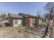 Charming single-story home featuring a green exterior, red trim, and a well-maintained yard at 3652 Yellow Poplar Ct, Indianapolis, IN 46222