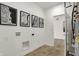 Functional laundry room decorated with city maps and tile flooring at 3769 Cantebury Dr, Franklin, IN 46131