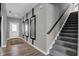 View of the entryway, showcasing the stairway, hall and decorative mirrors at 3871 Flora Dr, Franklin, IN 46131