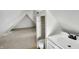 Finished attic featuring a unique bathroom area with a sink and toilet at 39 S Holmes Ave, Indianapolis, IN 46222