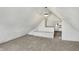Spacious finished attic room with a built-in bench seating area and natural light at 39 S Holmes Ave, Indianapolis, IN 46222