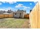 Fenced backyard with a small yard and direct home access via some stairs at 39 S Holmes Ave, Indianapolis, IN 46222