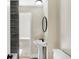 Bathroom featuring a pedestal sink and a modern round mirror at 39 S Holmes Ave, Indianapolis, IN 46222