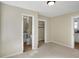 Bright bedroom featuring carpet floors, multiple entryways, and neutral paint at 39 S Holmes Ave, Indianapolis, IN 46222