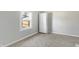 Cozy bedroom with a window offering natural light and a built-in wardrobe at 39 S Holmes Ave, Indianapolis, IN 46222