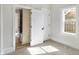 Bedroom with carpet, white trim, double closets, and a window that provides natural light at 39 S Holmes Ave, Indianapolis, IN 46222