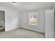 Minimalist bedroom featuring neutral walls, carpet flooring and natural light at 39 S Holmes Ave, Indianapolis, IN 46222