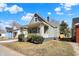Attractive home with a covered porch, fresh exterior, and well-maintained lawn at 39 S Holmes Ave, Indianapolis, IN 46222