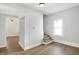 Bright hallway area leads to stairs and other rooms; hardwood floors at 39 S Holmes Ave, Indianapolis, IN 46222