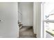 Carpeted staircase leading to the upper levels of the home, with a window view at 39 S Holmes Ave, Indianapolis, IN 46222