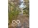 Gravel driveway leads up to the home and is surrounded by mature trees at 4031 N Banta Rd, Bargersville, IN 46106