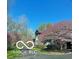 Stunning exterior view of a home featuring vibrant pink trees in a well-manicured yard at 4031 N Banta Rd, Bargersville, IN 46106