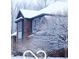 Charming brick home is surrounded by snow-covered trees and landscaping at 4031 N Banta Rd, Bargersville, IN 46106