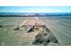 A captivating aerial image reveals a countryside property, complete with a home, green-roofed shed, and expansive field setting at 4254 N 200 W, Greenfield, IN 46140