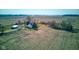 A serene aerial view of a farmhouse surrounded by farmland, showcasing peaceful rural living at 4254 N 200 W, Greenfield, IN 46140