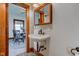 Bathroom with vintage sink and fixtures, and a view to the dining room at 4254 N 200 W, Greenfield, IN 46140