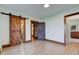 Bright bedroom with a barn door to the bathroom and wood trim at 4254 N 200 W, Greenfield, IN 46140