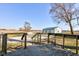 Spacious wooden deck with views of a well-maintained backyard and detached garage at 4254 N 200 W, Greenfield, IN 46140