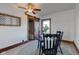 Eat-in kitchen featuring a dining set, stylish ceiling fan, and a sliding barn door at 4254 N 200 W, Greenfield, IN 46140