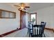 Dining area features a dining set, stylish ceiling fan, and a sliding barn door at 4254 N 200 W, Greenfield, IN 46140